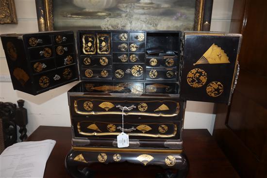 A good Japanese silver mounted gold lacquered table cabinet, Meiji period, H. 53cm, W. 43cm, minor faults